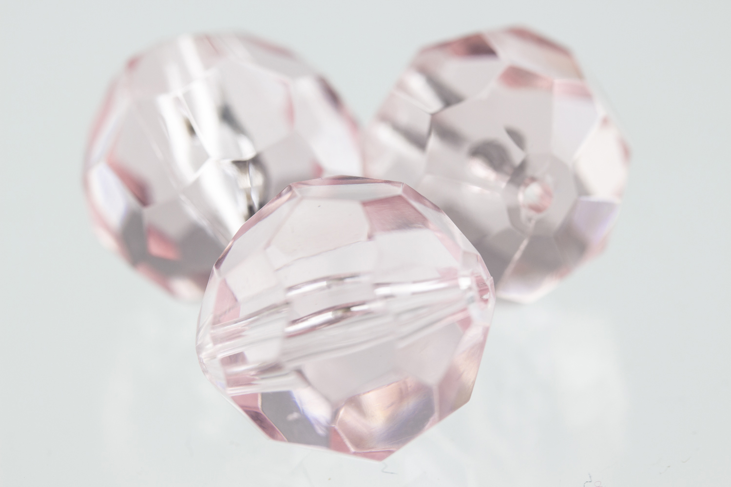 16mm  facettierte Rundperle in  shrimp rosa Transparent